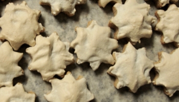 Cinnamon stars (Zimtsterne, German christmas cookies) on a baking tray